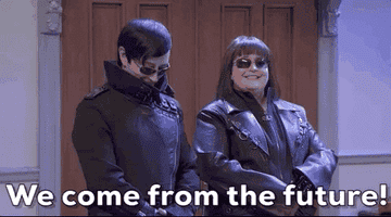 a gif of Aidy Bryant on &quot;Saturday Night Live&quot; dressed up in all black saying &quot;we come from the future&quot;