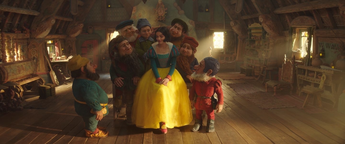 she&#x27;s dressed as snow white and surrounded by the 7 dwarfs
