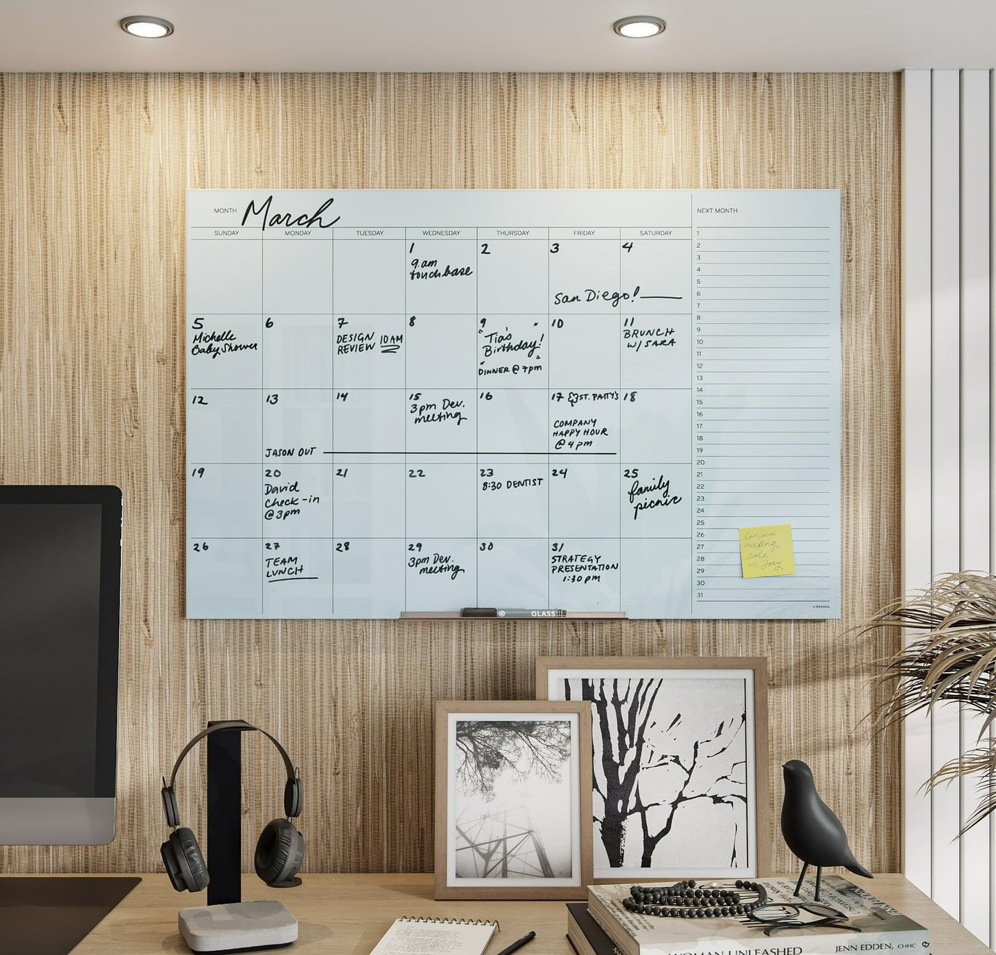 a glass dry erase calendar in a home office