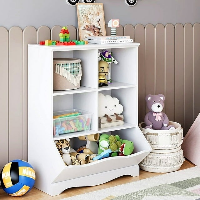 A children&#x27;s toy cabinet filled with stuffed animals and other toys