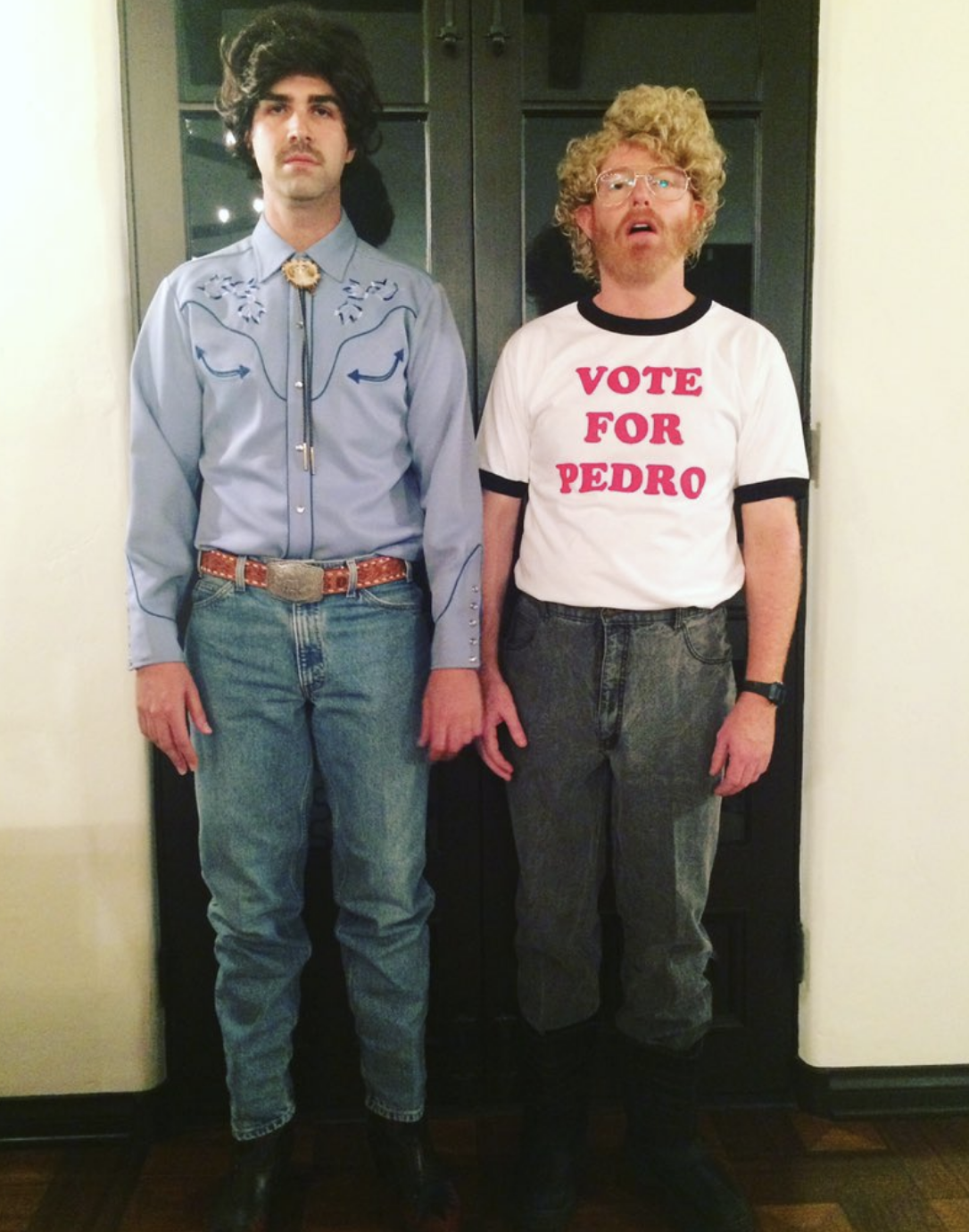 both in the outfits, one wearing the vote for pedro shirt