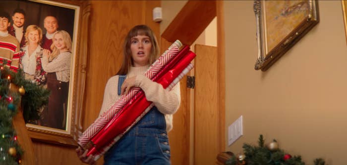 Leighton Meester holding Christmas wrap and looking appalled