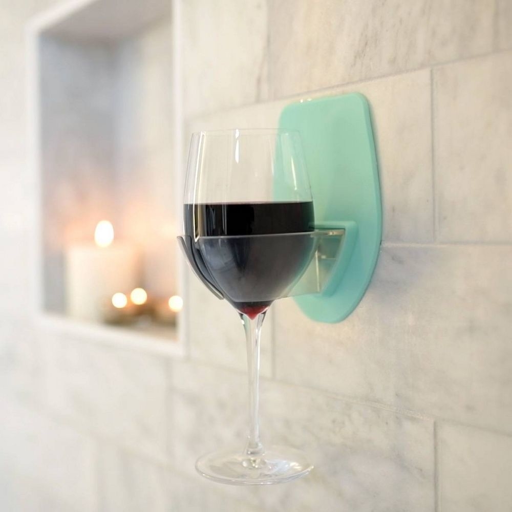 the wine holder suctioned to the shower wall