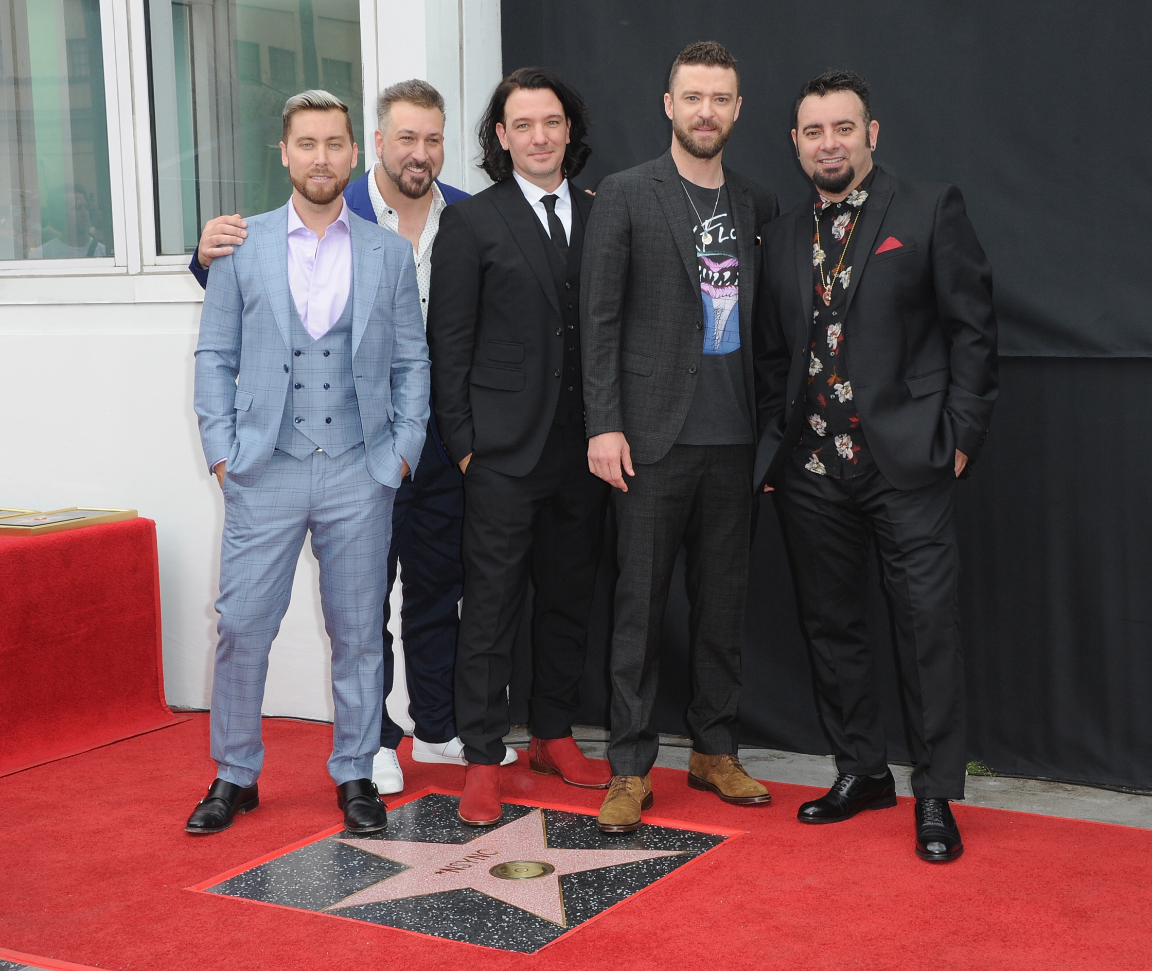 the members of nsync next to their hollywood star