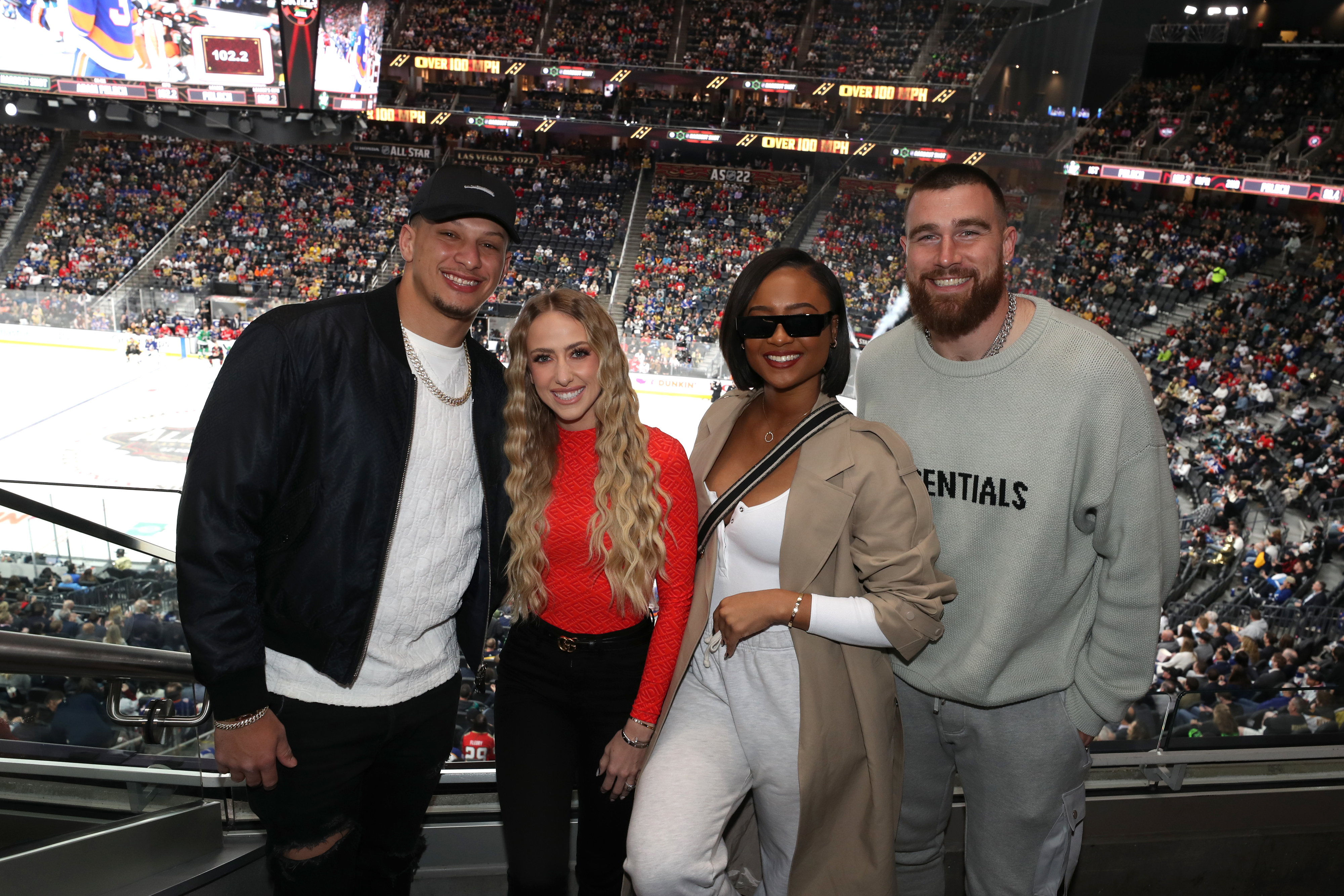 patrick, brittany, kayla, and travis at a hockey game