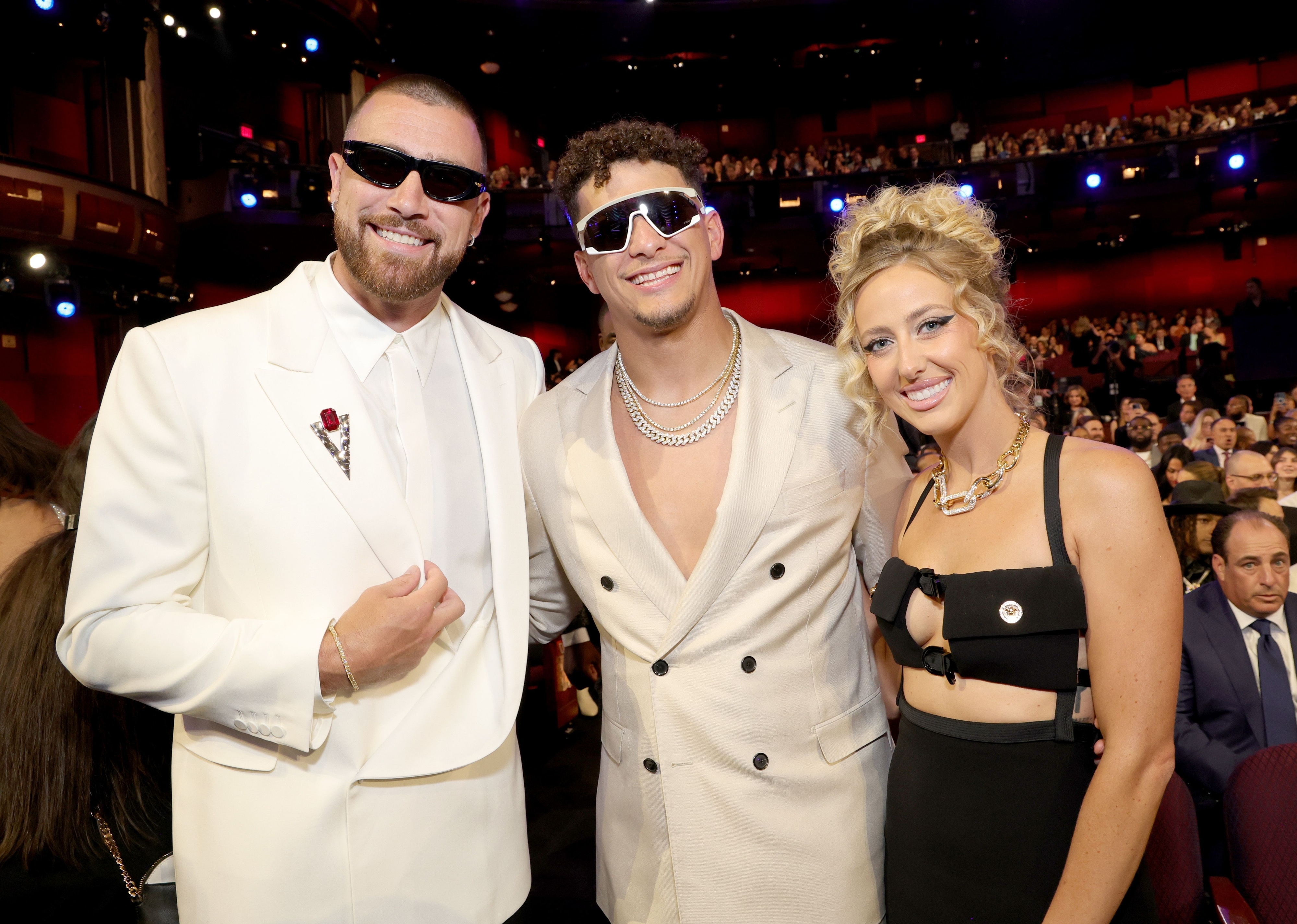 travis, patrick and brittany at an event