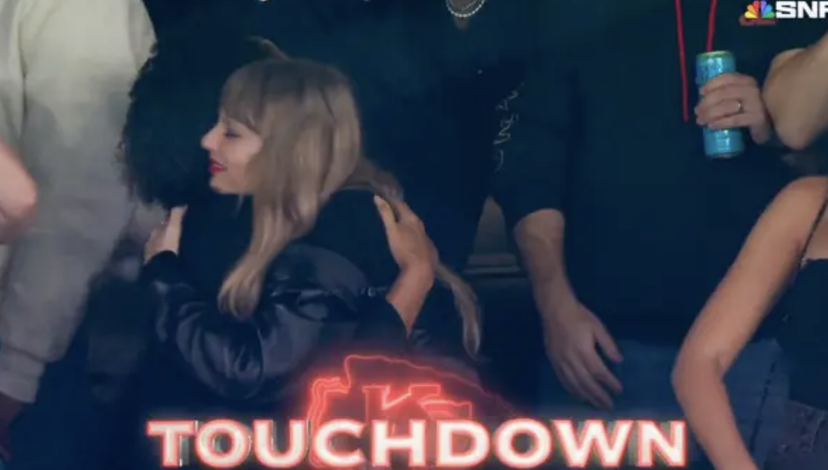 taylor hugging friends during a touchdown