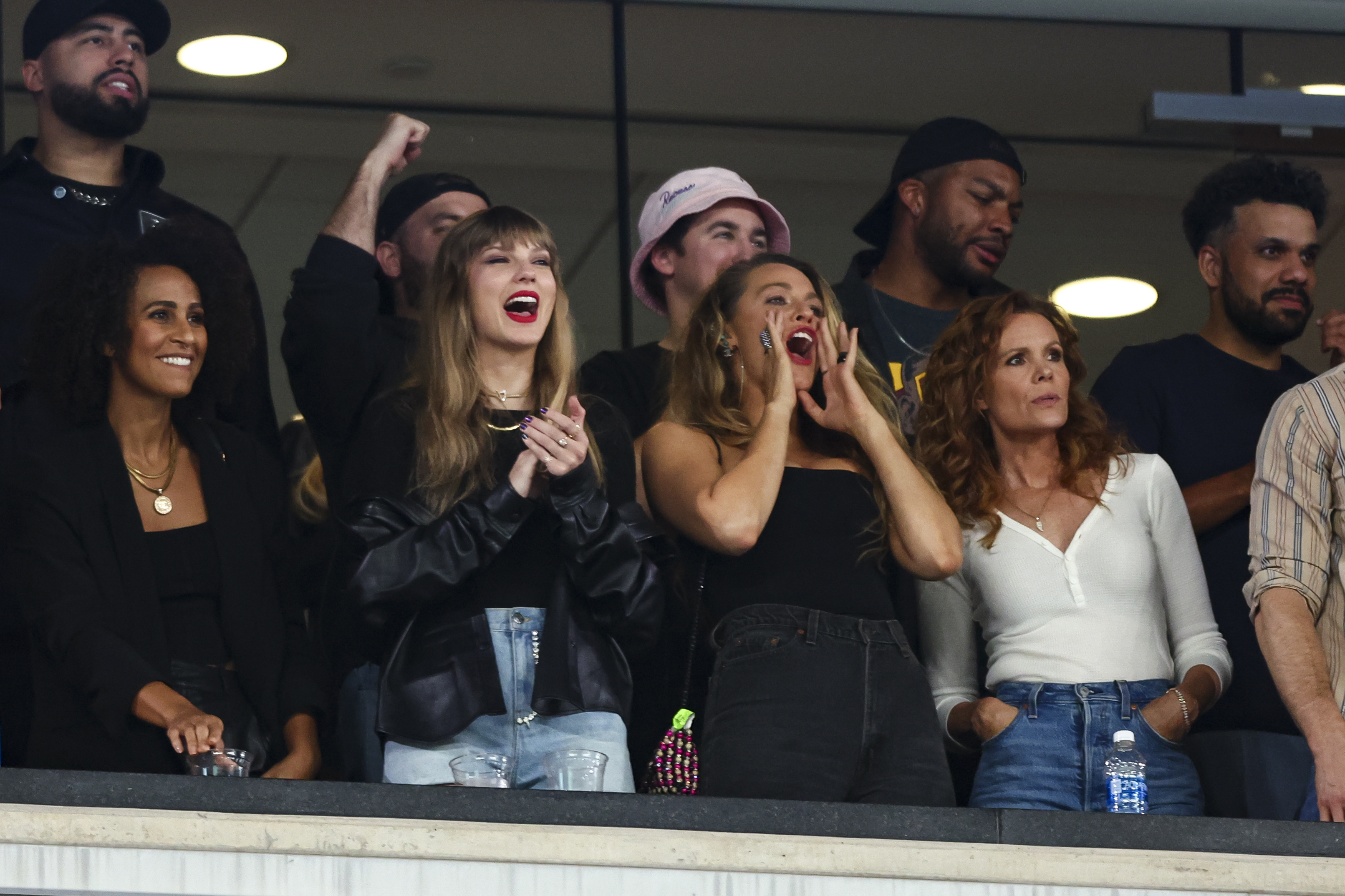 taylor and friends cheering at the game