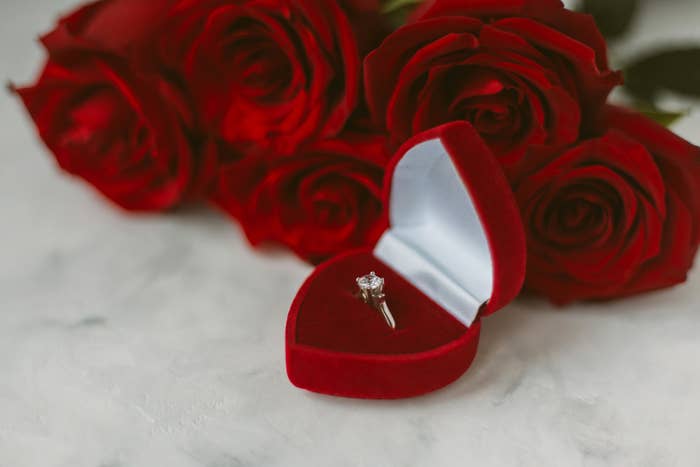 An engagement ring in a heart-shaped box