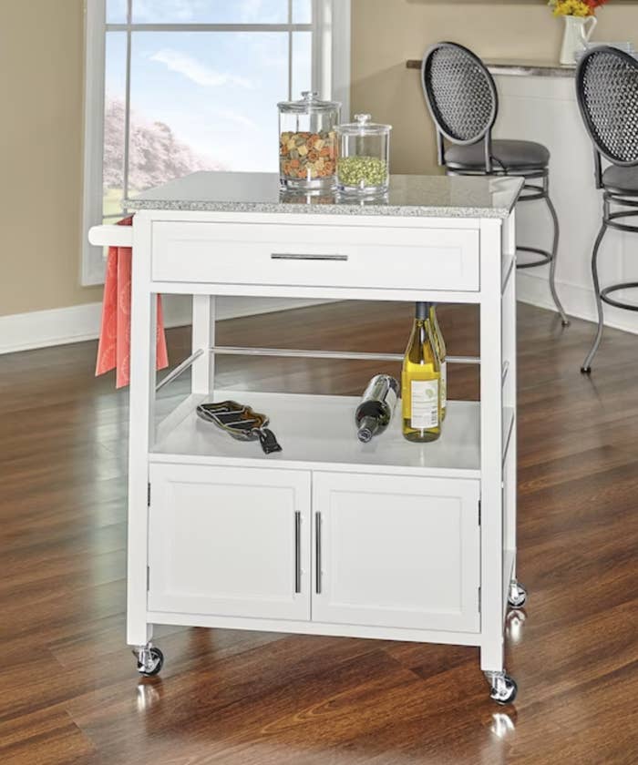 rolling cart with wine and accessories