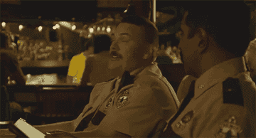 Two cops sit in a car and say &quot;Canada's pretty awesome!&quot;