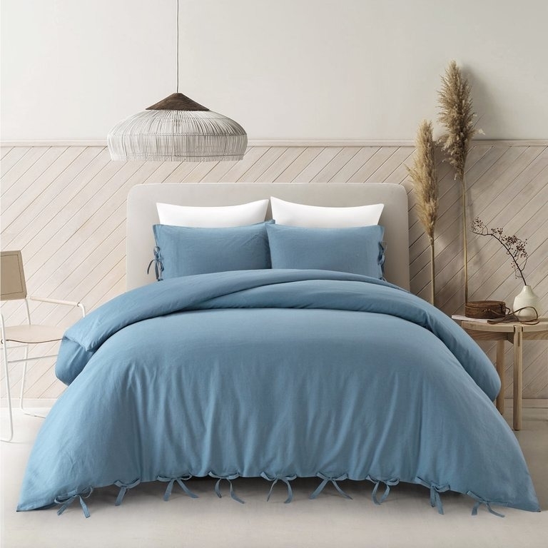 the blue bedspread on a bed