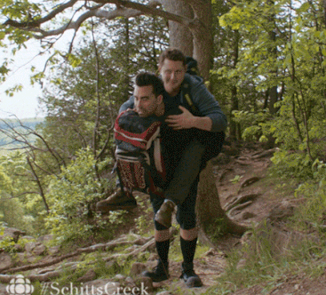 David carries Patrick on his back during a hike gone wrong (Schitt's Creek).