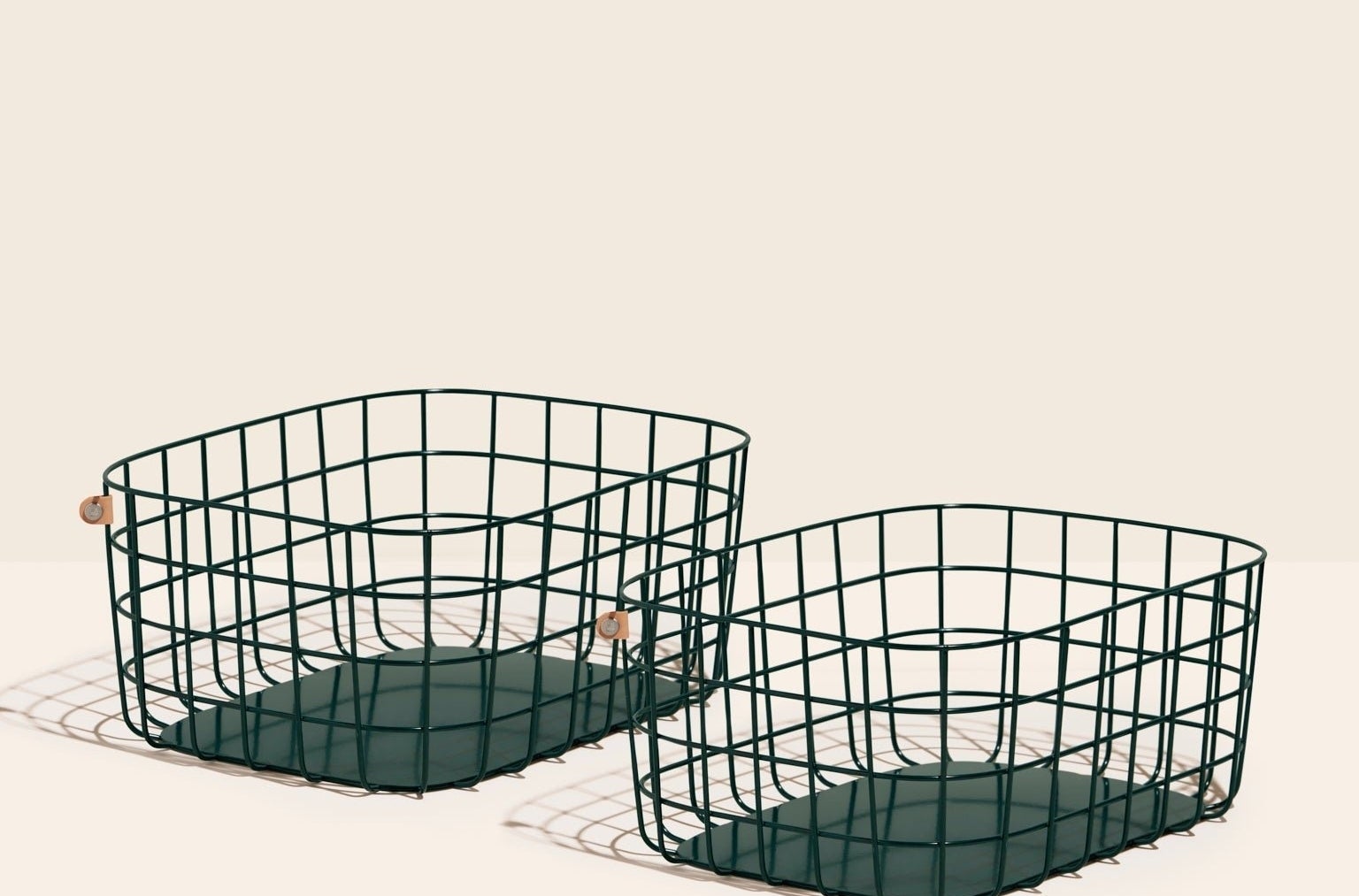set of two dark green metal open baskets