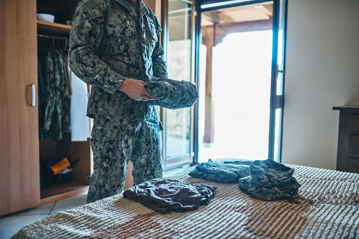 A US military man next to his bed
