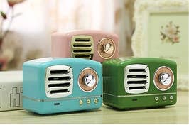 Mini retro-looking radio speakers in blue, green, and pink