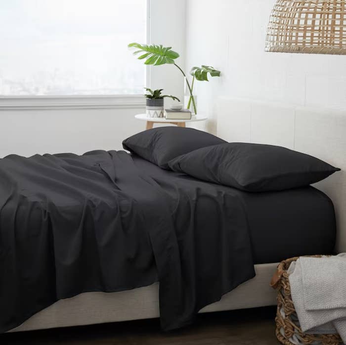 bedroom staged with black sheets