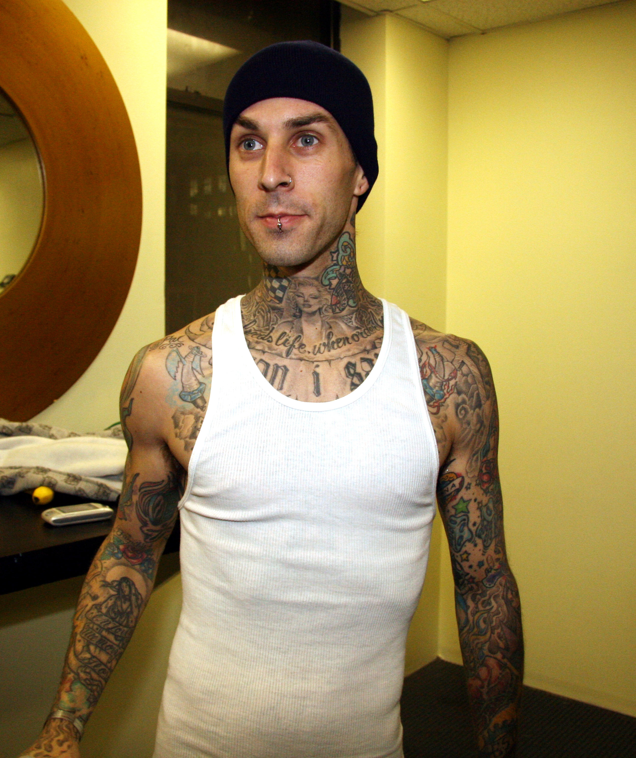 Close-up of Travis in an undershirt and beanie
