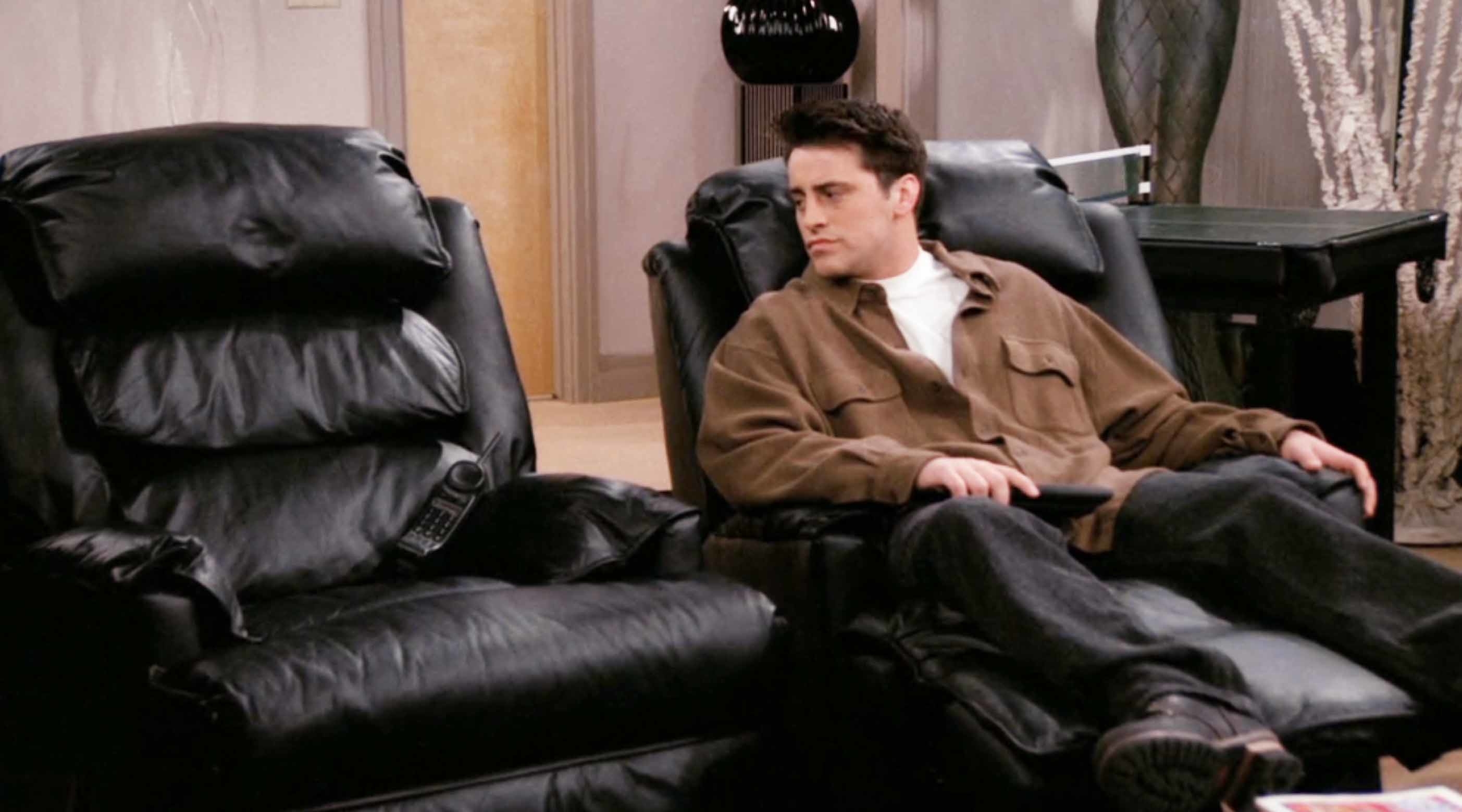 Matt on the show looking at an empty reclining chair next to his