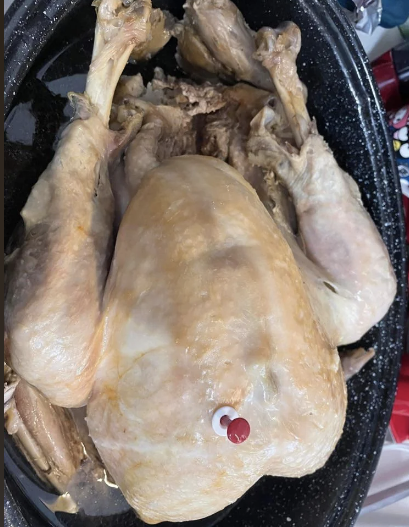 This turkey has been placed on the table looking severely undercooked