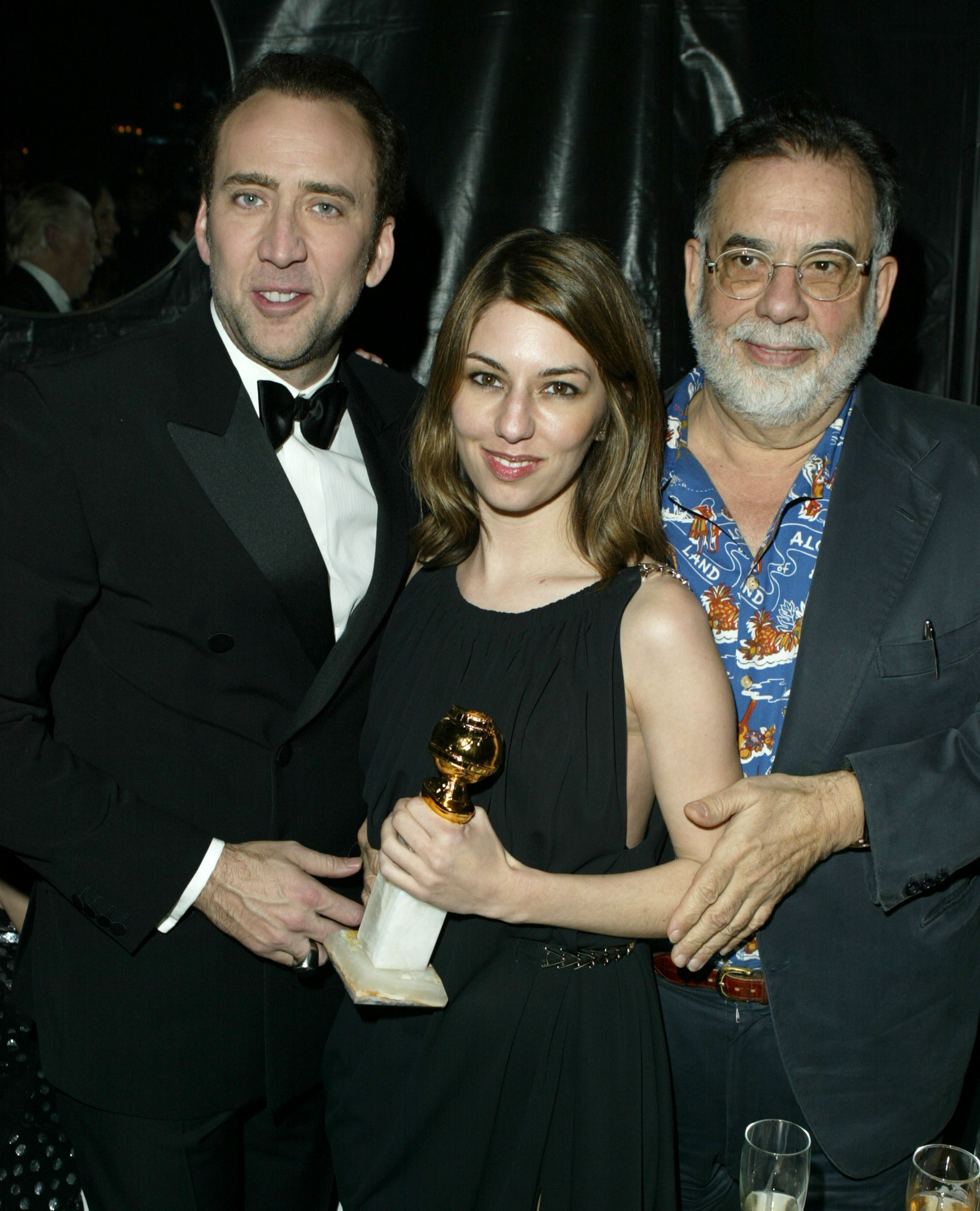 A photo of nicolas sofia and francis holding an award