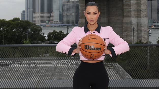 kim kardashian holds basketball