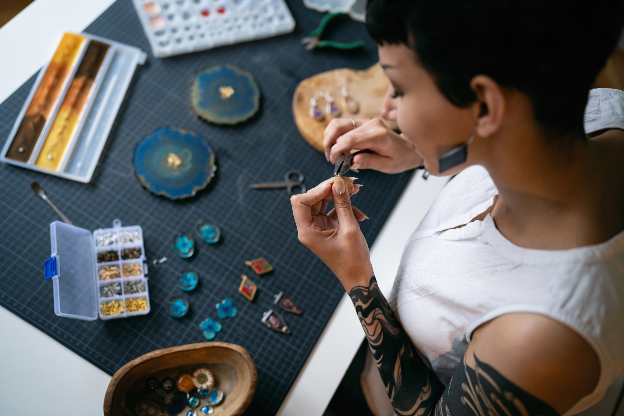 a woman making jewelry