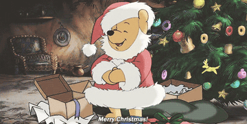 a gif of winnie the pooh dressed as santa claus