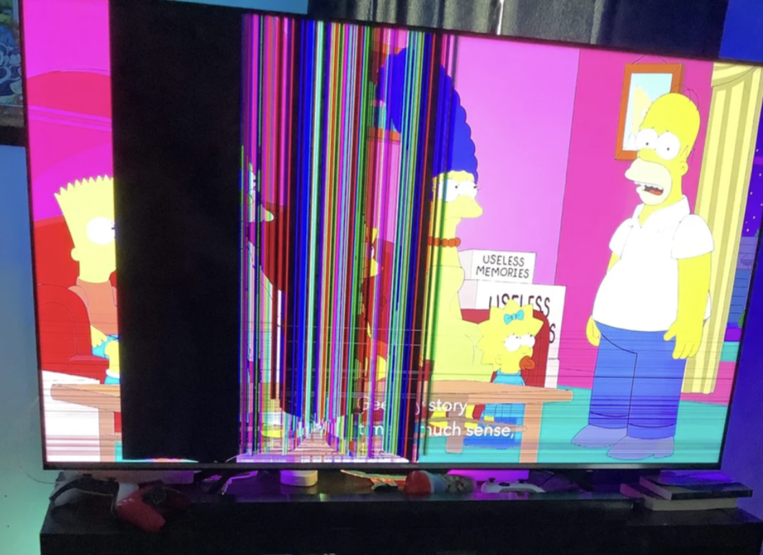 TV showing a scene from the simpsons with a bunch of random lines and blurs added because it&#x27;s broken
