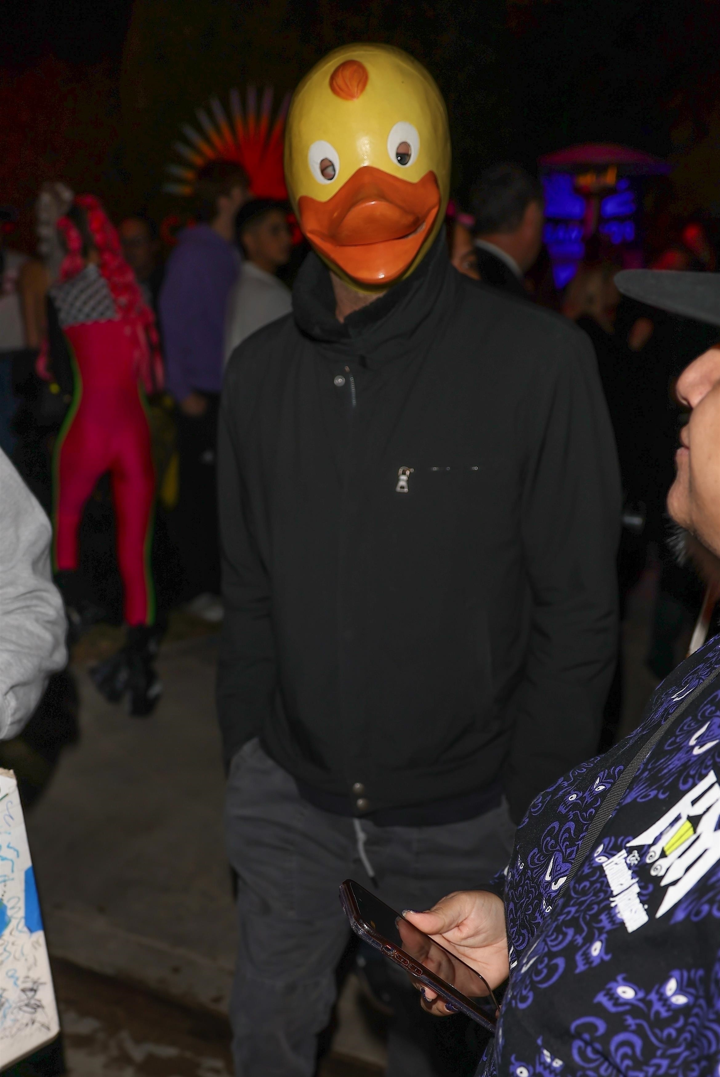 Closeup of Leonardo DiCaprio as a duck inside a party