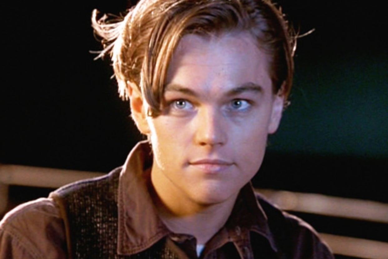 Leonardo DiCaprio staring straight ahead as he stands on a boat as Jack in Titanic