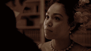 A closeup of her character saying, "of course"