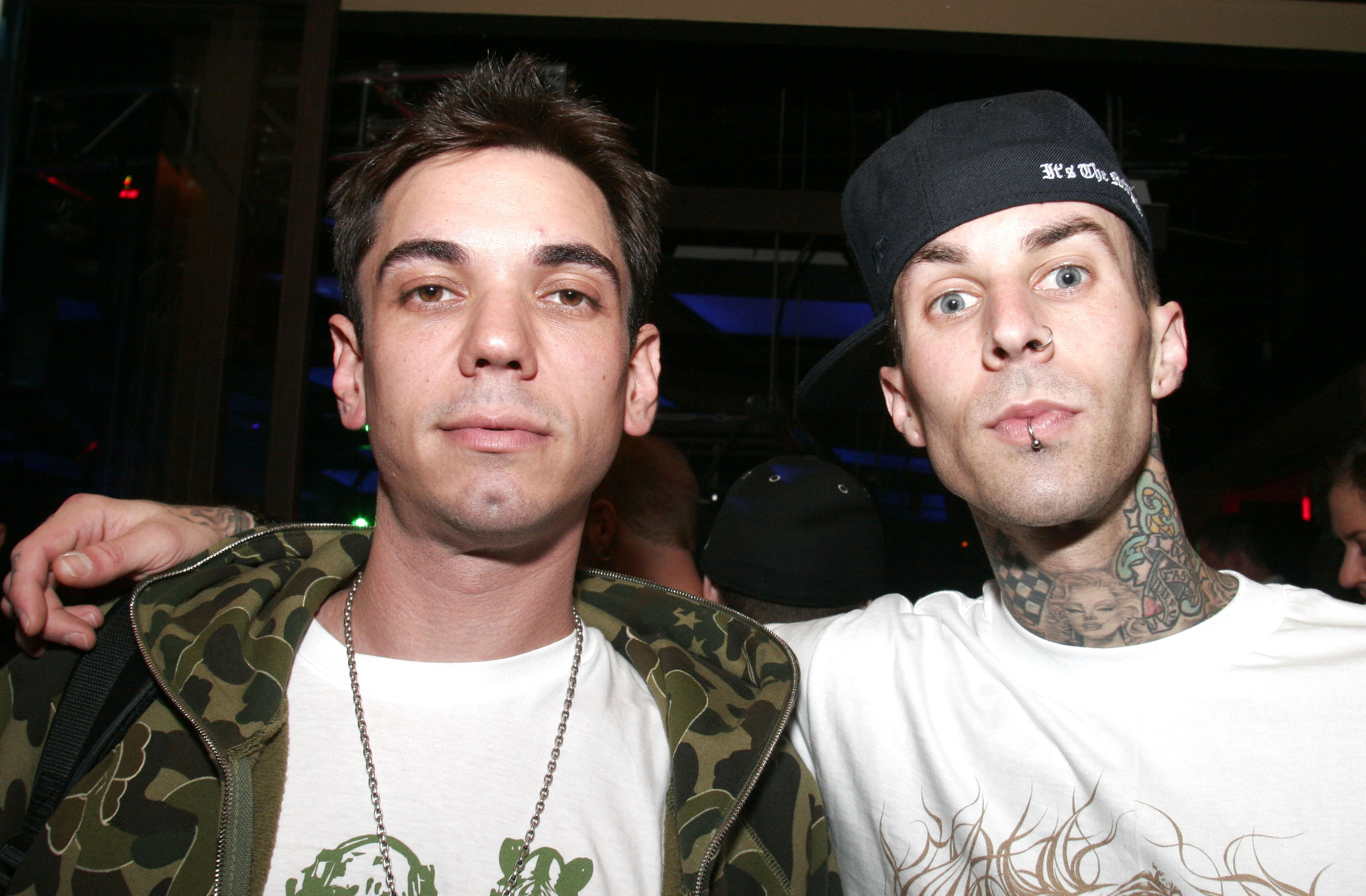 closeup of the two with travis&#x27;s arm around dj am