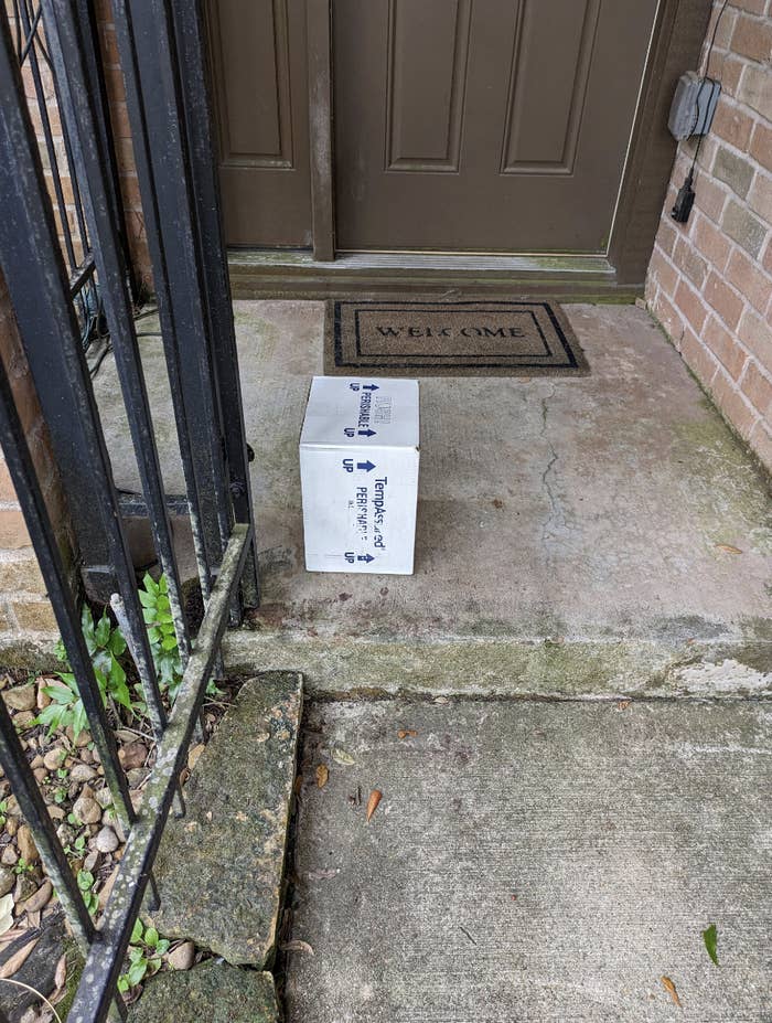the arrow on the box pointing to which side should be up and the person has instead left it on its side