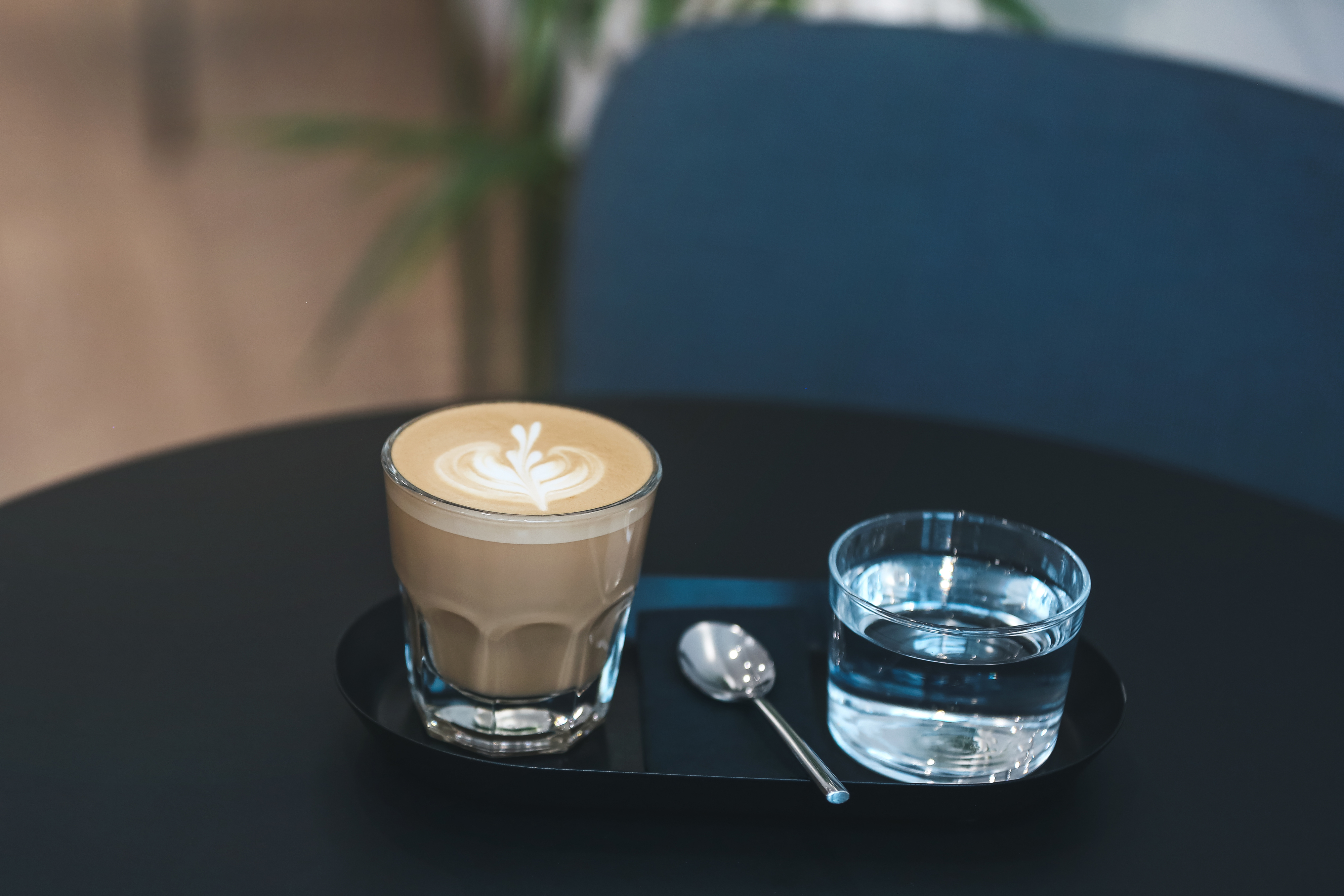 a coffee and a small water glass