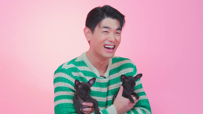 Eric Nam holding puppies