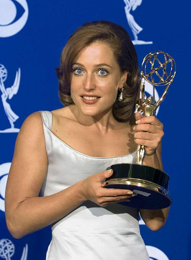 Closeup of Gillian Anderson holding an Emmy
