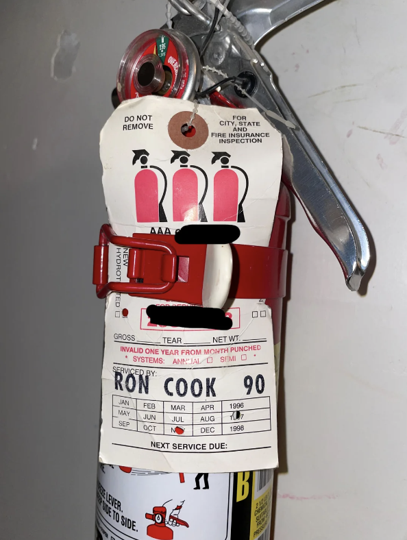 expiration tag on the extinguisher