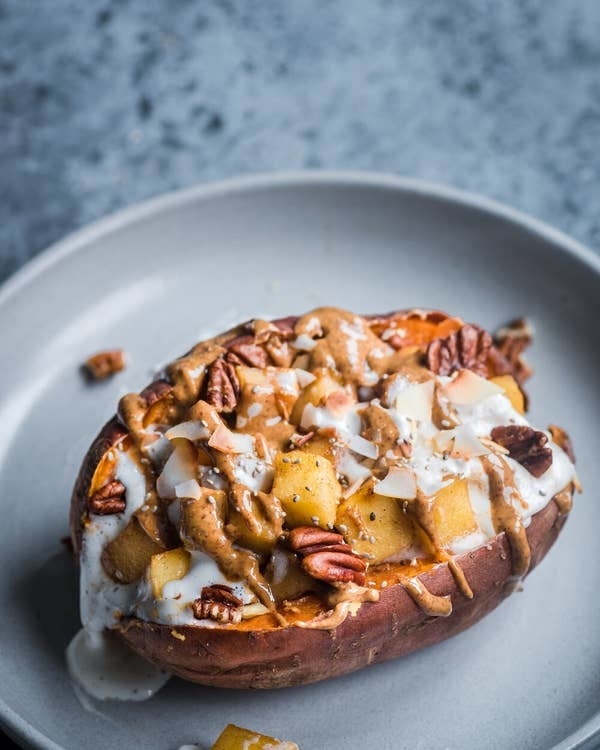 baked sweet potato with apple and almond butter topping