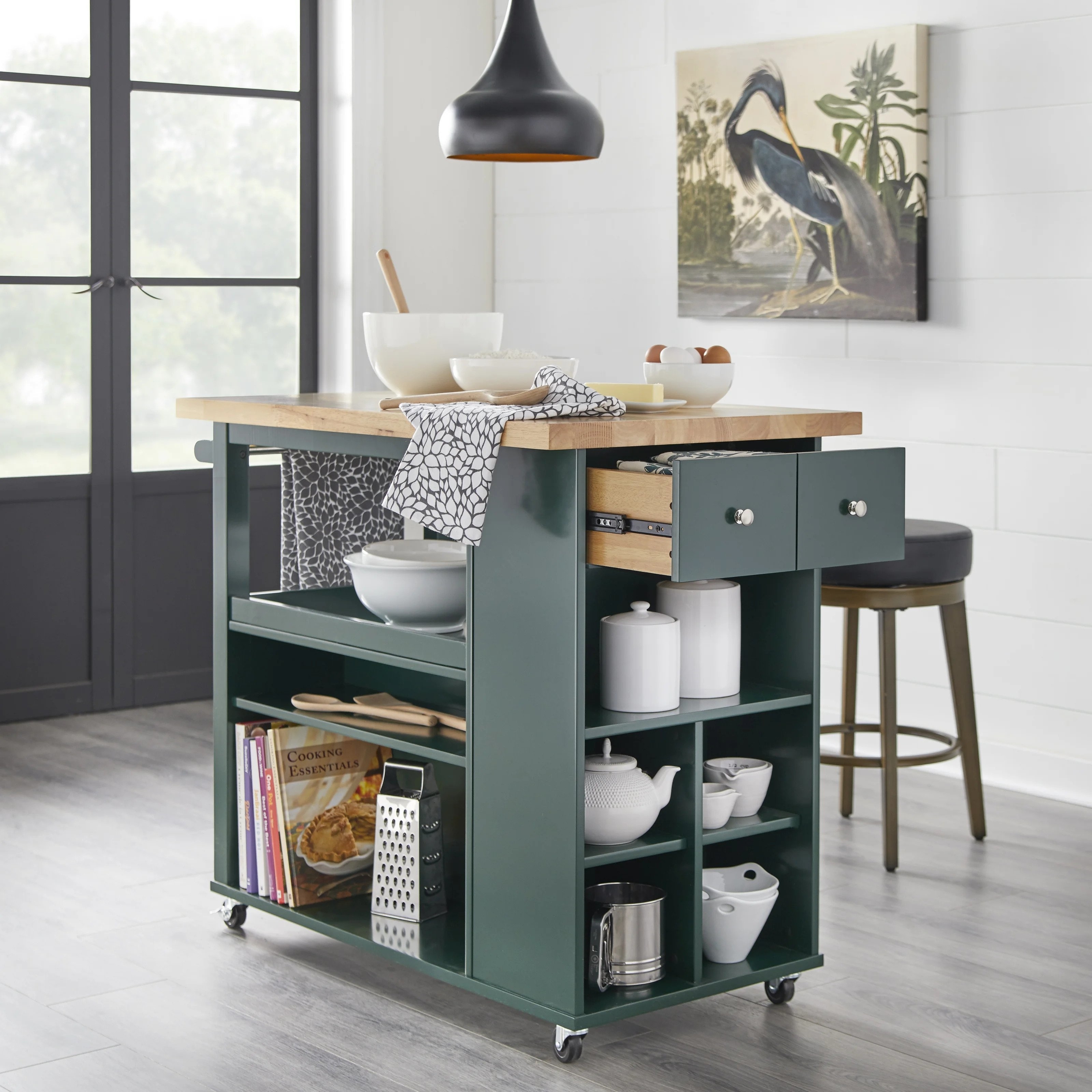 The cart in dark green, featuring a natural wood top and silver pulls
