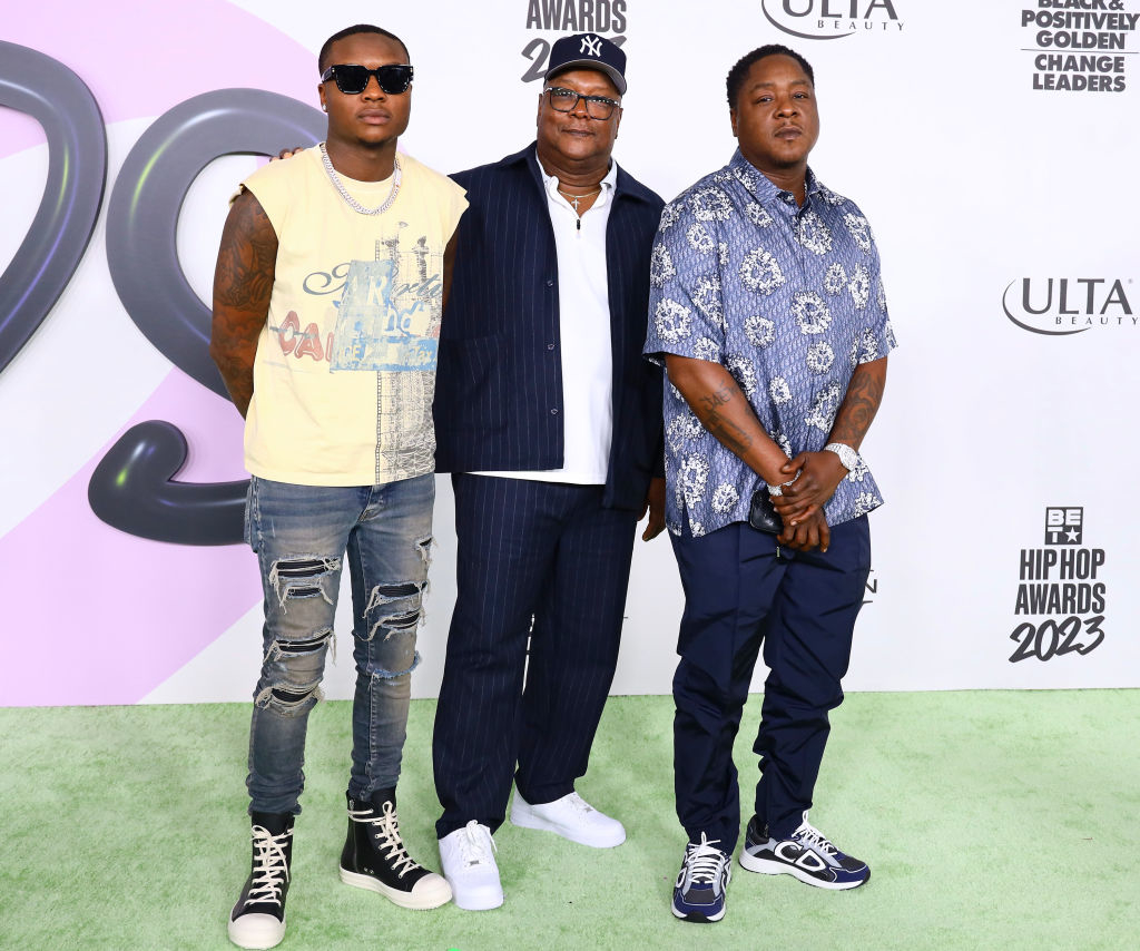 Jadakiss, accompanied by his father and son