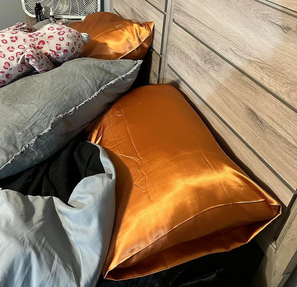 Reviewer image of the two orange satin pillowcases