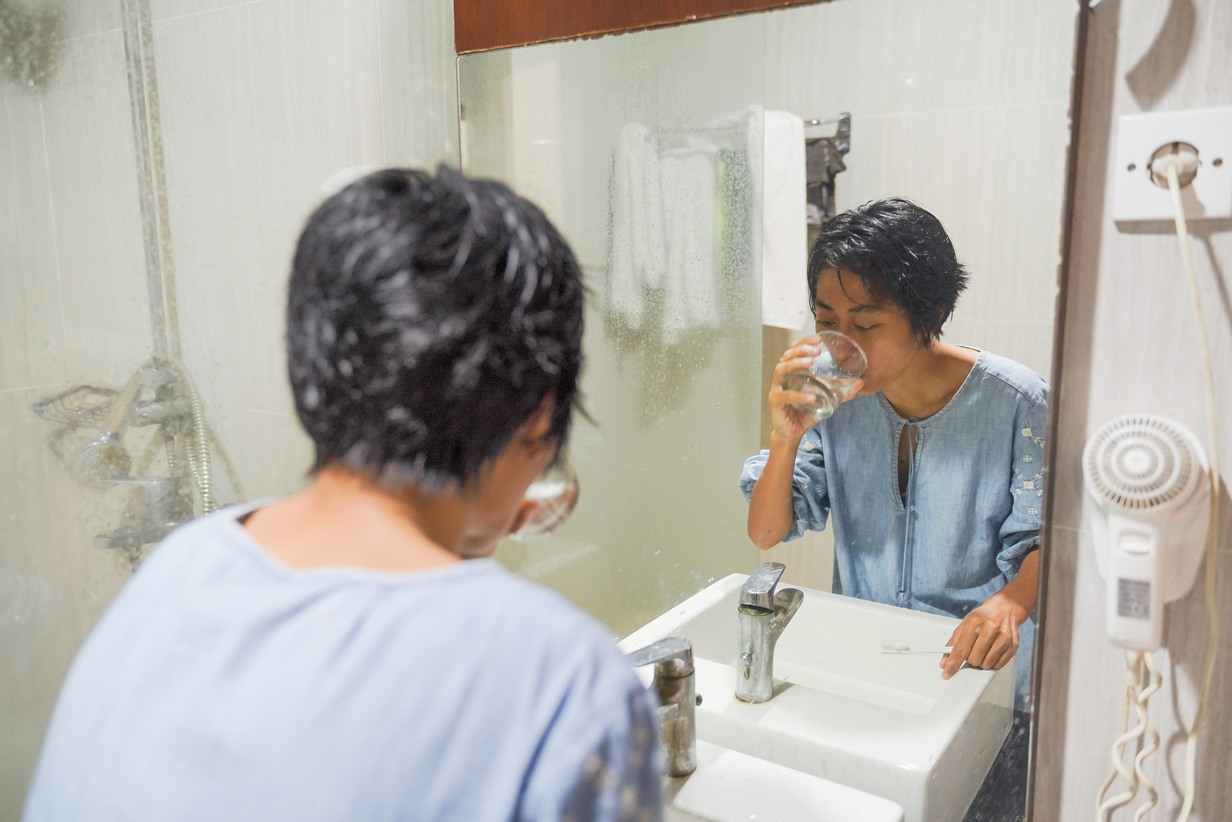 a woman gargling with water