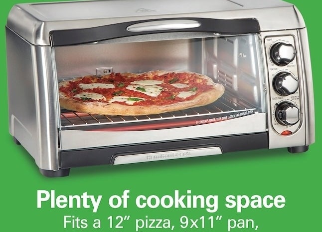 the toaster oven with a pizza in it