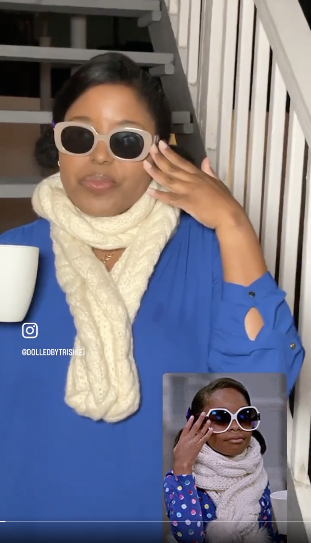 woman in a large scarf and circular sunglasses