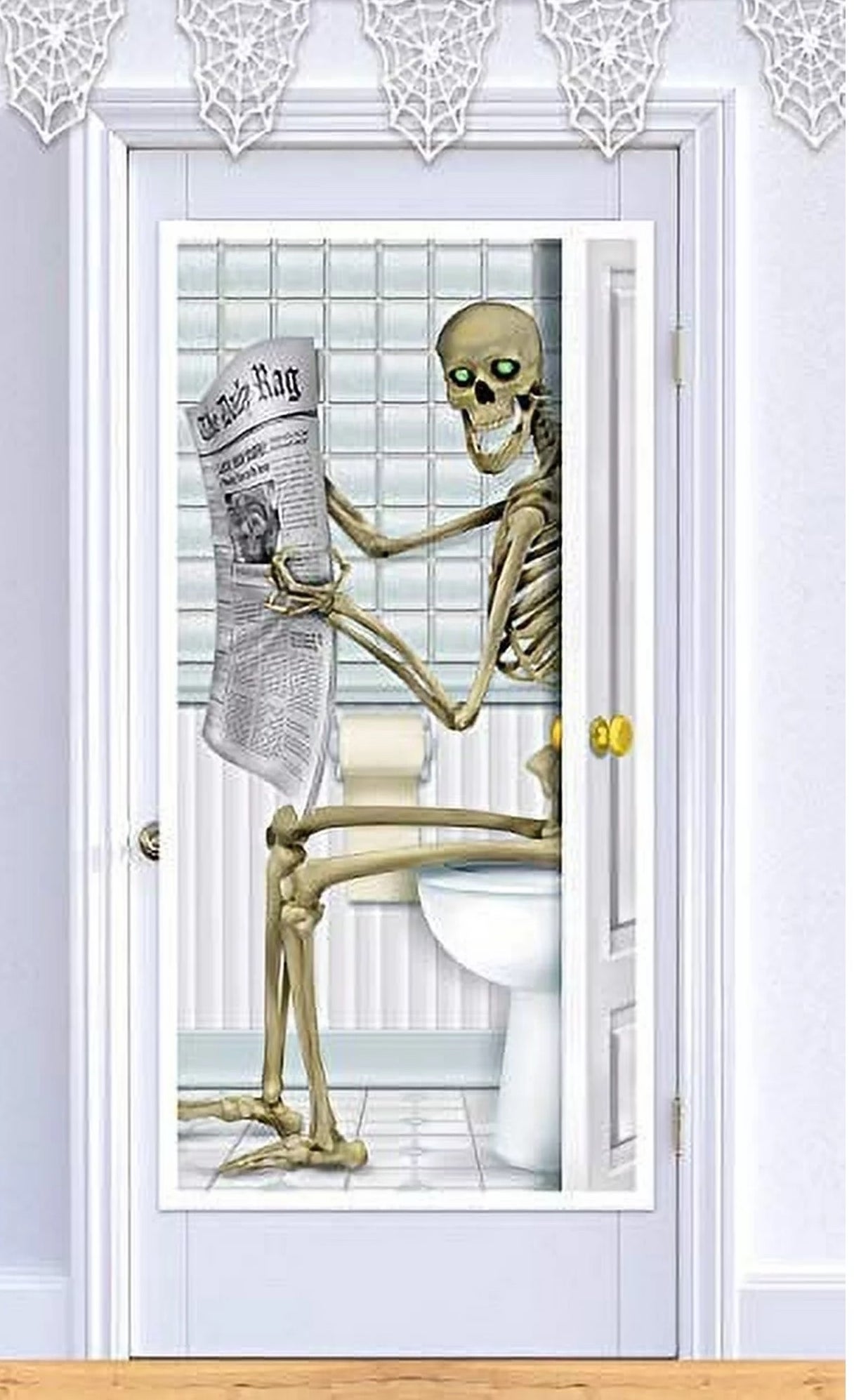 a door cover feating a skeleton on a toilet reading a newspaper