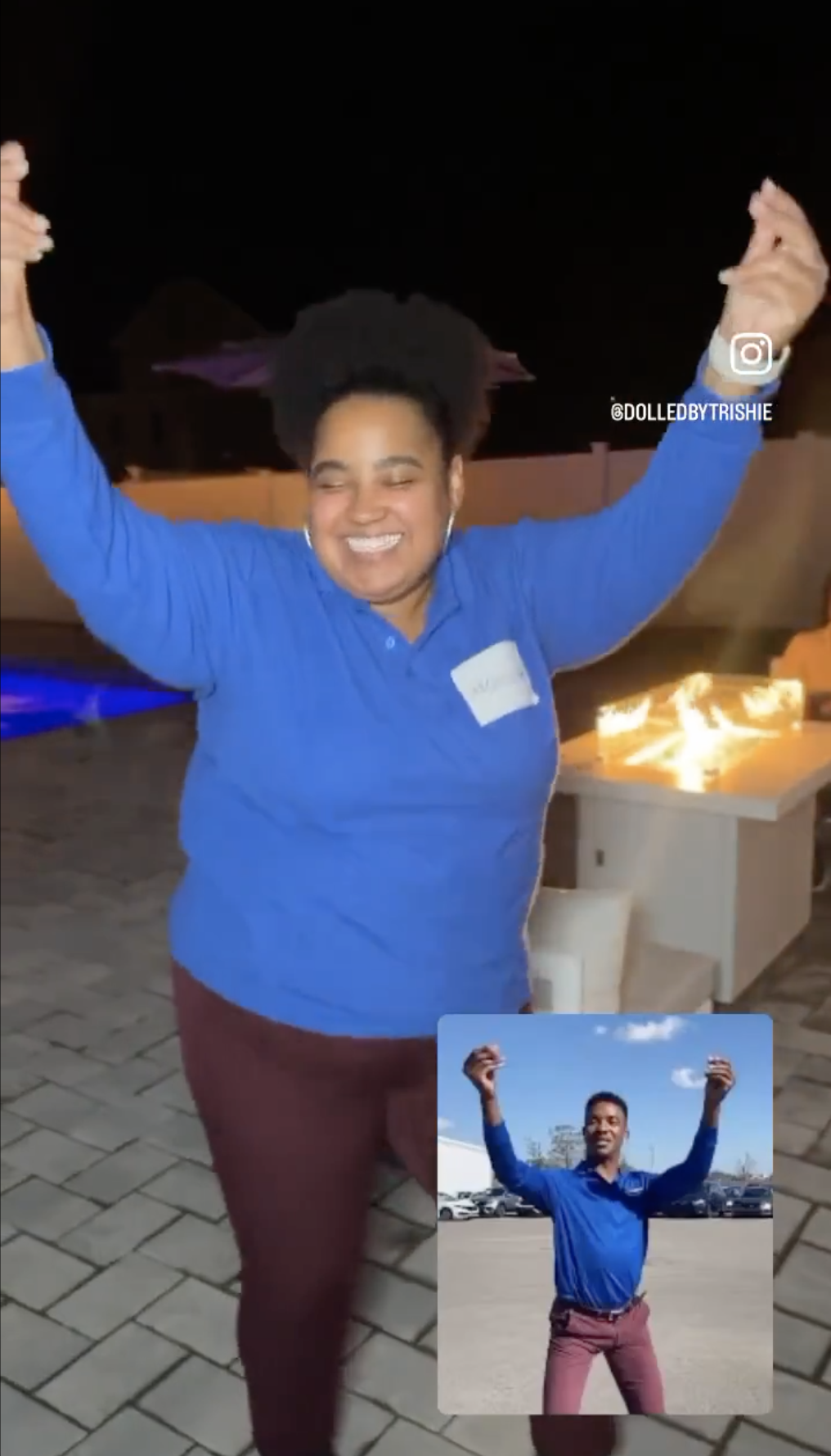 person in pants and a long sleeve tee with their arms in the air