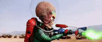 an alien from &quot;Mars Attacks!&quot; shoots a green laser