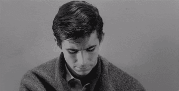 Norman Bates looking up at the camera in the final shot of &quot;Psycho&quot;