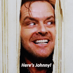 Jack Nicholson in &quot;The Shining&quot; saying &quot;Here&#x27;s Johnny!&quot;